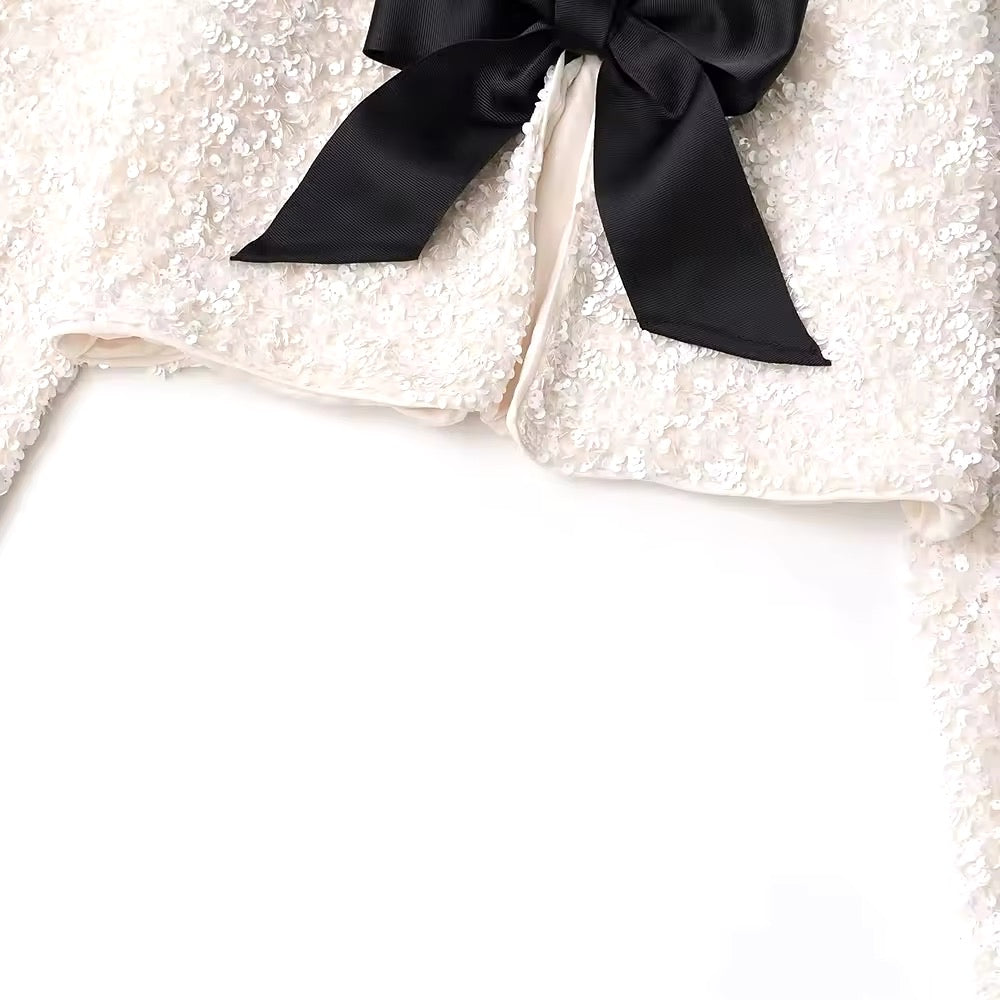 Veste courte à paillettes • Femme