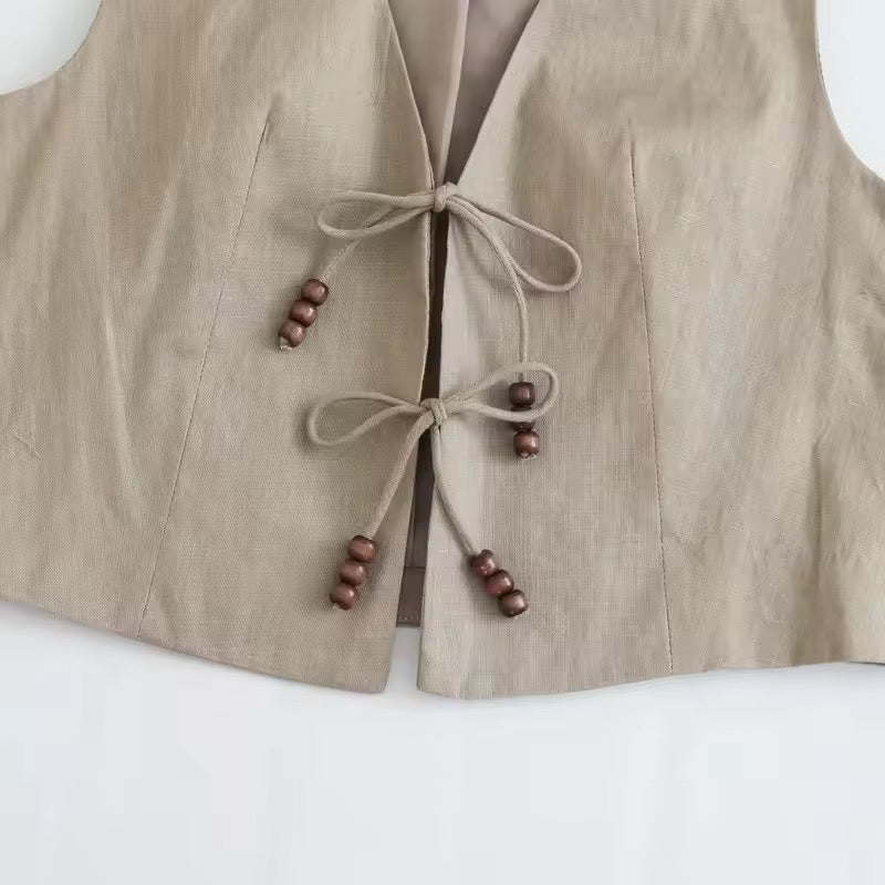 GILET COURT À LIENS ET PERLES BOIS