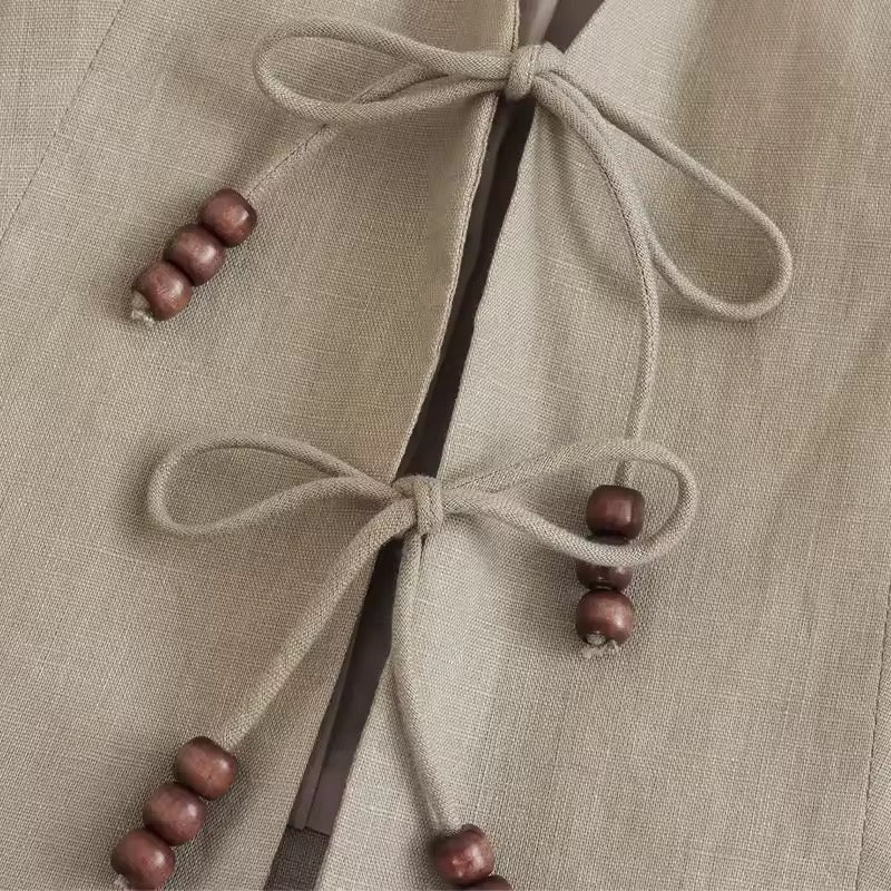 GILET COURT À LIENS ET PERLES BOIS