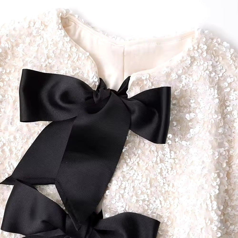 Veste courte à paillettes • Femme