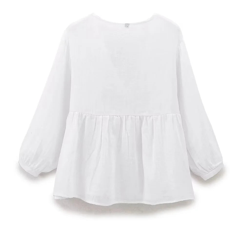 Blusa ricamata decorata con pizzo