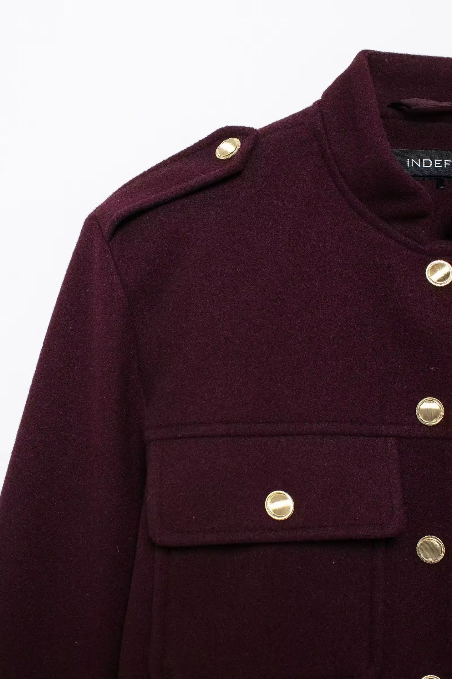 Veste boutonnée en or