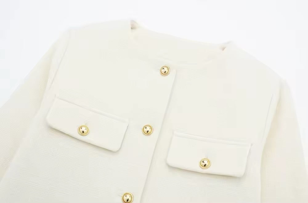 Veste élégante boutonnée en or